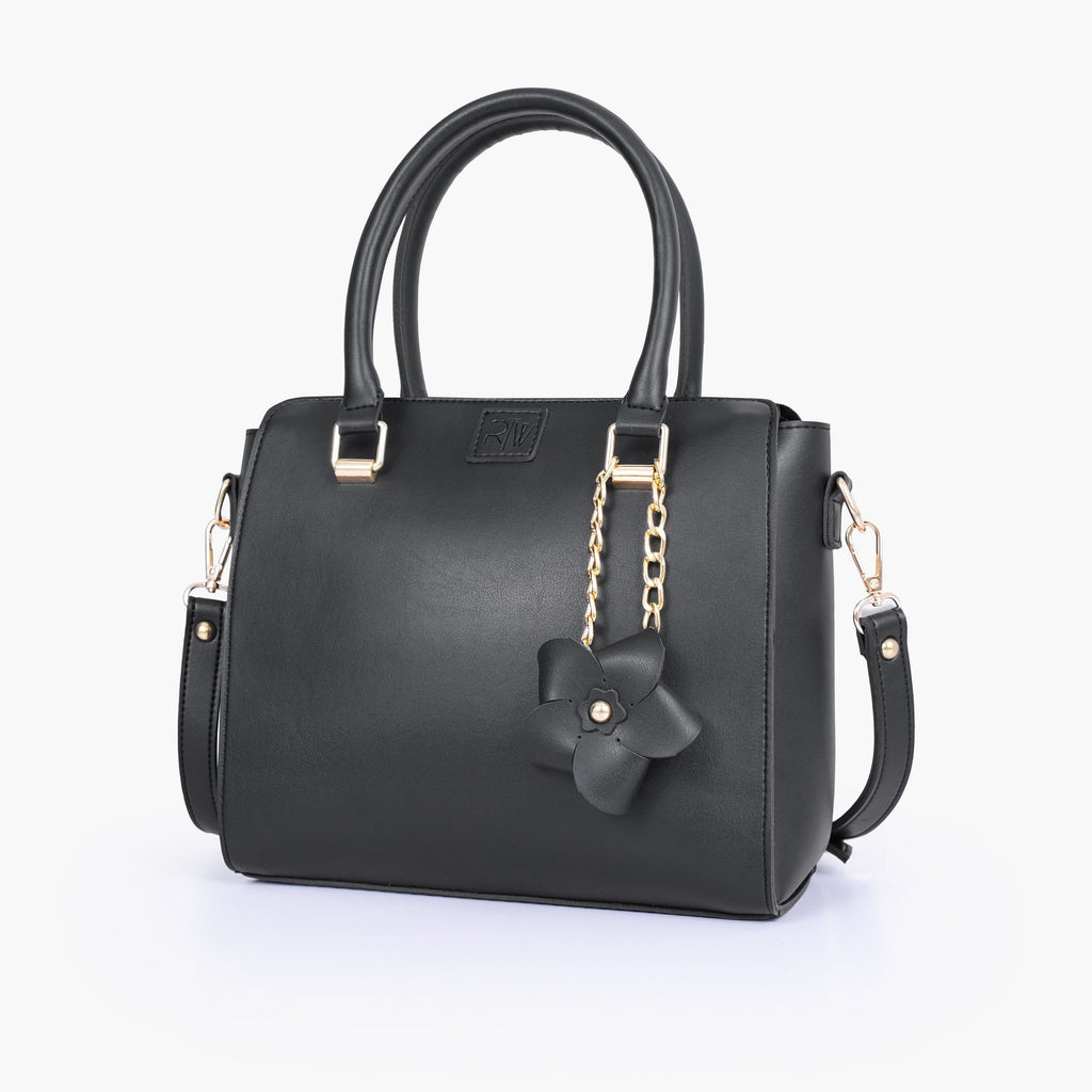 Black handbag with flower charm