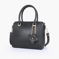Black handbag with flower charm