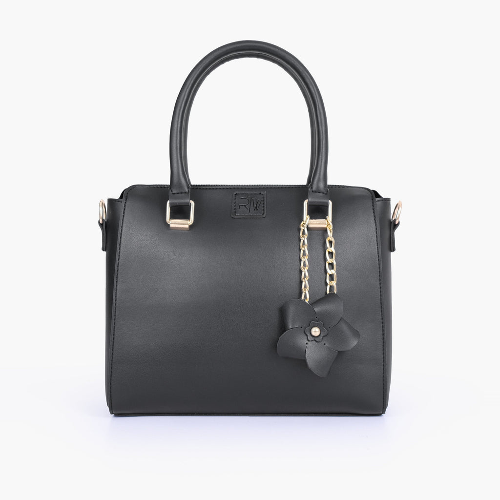 Black handbag with flower charm