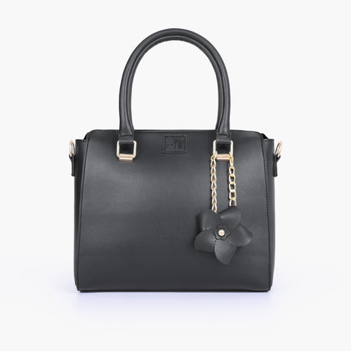 Black handbag with flower charm