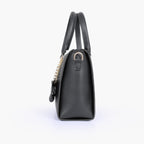 Black handbag with flower charm