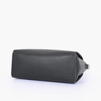 Black handbag with flower charm