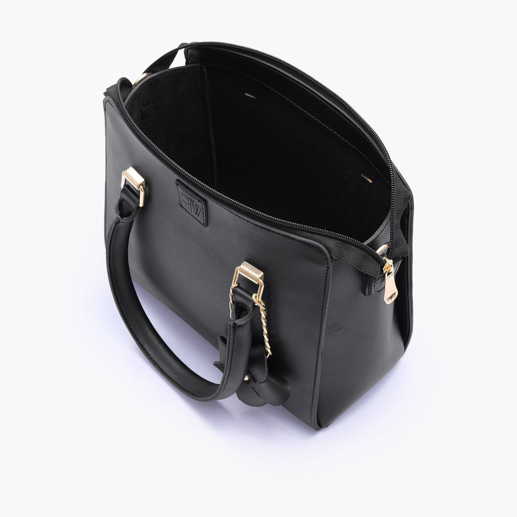 Black handbag with flower charm