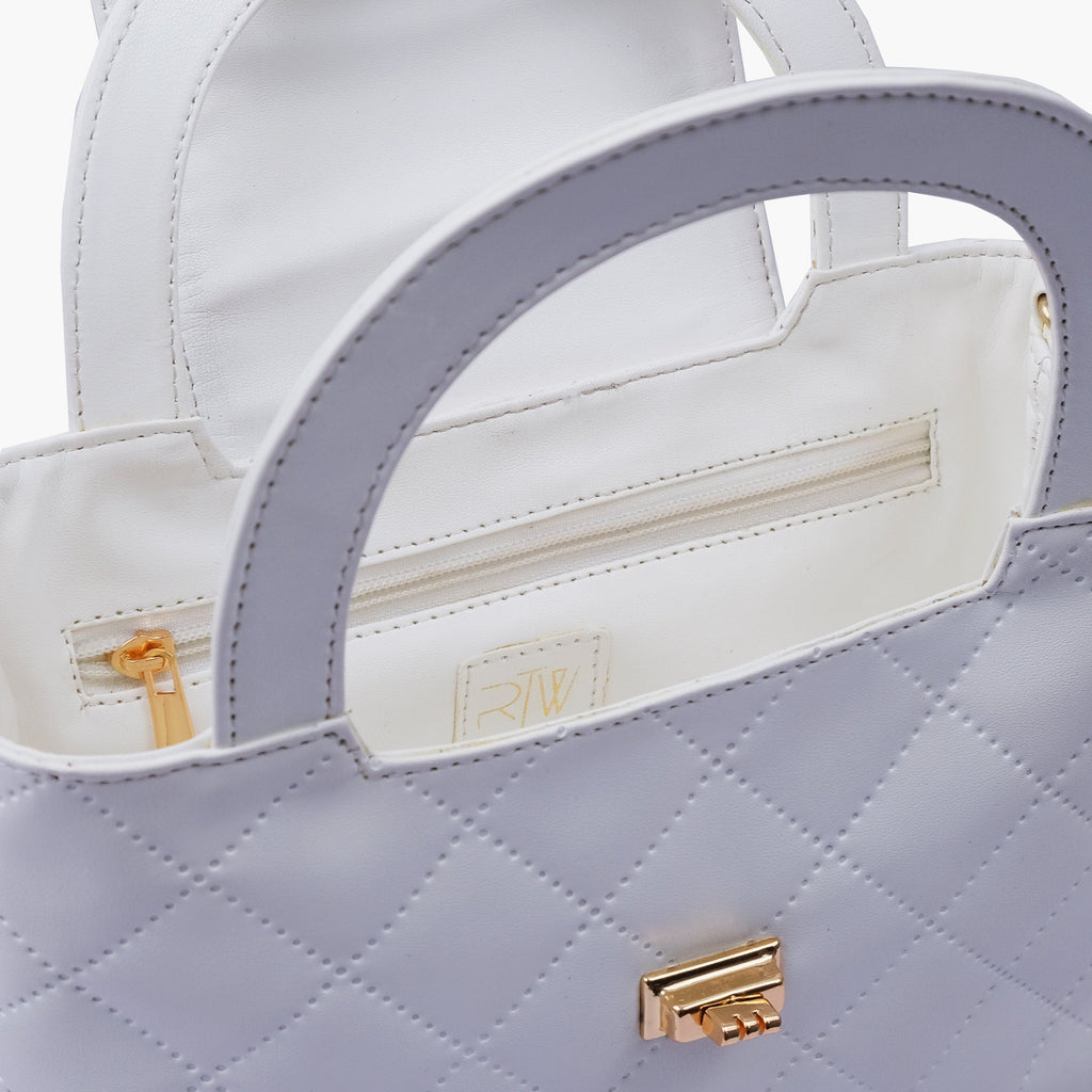 White flap quilted bag with top handle