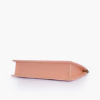 Peach quilted evening clutch with snap closure