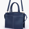 Blue trapeze top-handle bag