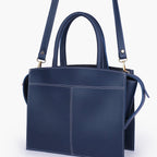 Blue trapeze top-handle bag